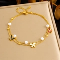 Detail of gold double-layer anklet featuring pearl charms and colorful butterfly pendants - Colorful Butterfly Style (B1572)
