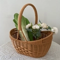 Brown oval woven picnic basket with handle, featuring fresh vegetables and flowers - Yuanbao Shape Handheld Basket 35x27x14cm