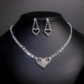 Elegant silver heart-shaped jewelry set featuring sparkling rhinestones on black bust - TL120/Silver Heart Rhinestone Style