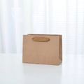 Vertical kraft paper shopping bag in natural brown with sturdy woven flat handles - Small Horizontal Style