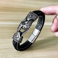 Macro detail of men's braided leather bracelet with vintage engraved metal charm - 18cm / Single Leather Rope