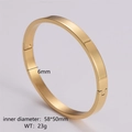 Close-up of gold minimalist bangle with 6mm width and 58x50mm inner diameter specs - Women's Gold
