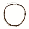 Close-up of bohemian coconut shell and tiger eye stone beads on this handmade necklace - Tiger Eye Necklace