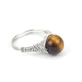 Detailed view of hand-wrapped silver wire ring featuring a gold tiger eye gemstone bead - Tiger Eye