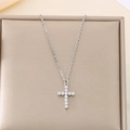 Dettaglio di collana in acciaio argento con croce di cristalli su portagioie oro - Acciaio (KN284935-Z)