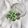 Matte light green flower hair claw clip on white fabric with shell tray background - Matte Green
