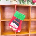 Red Christmas stocking featuring a snowman pattern and green sequined cuff decoration - Sequin Small Stocking (Snowman Style)