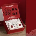 Wedding scented candle gift box featuring white bust sculptures and red packaging - Bluebell + Freesia Wedding Edition