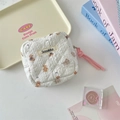 Detailed view of quilted sanitary pad storage bag featuring cute cartoon bear pattern - Small Grey Elephant