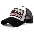 Detail of classic black and white trucker hat with Indian embroidery and mesh back - Adjustable / Black