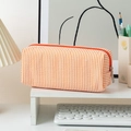 Seersucker pencil case featuring orange and white vertical stripes with a zipper closure - Orange Stripes