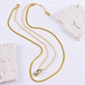 Double-layered stainless steel necklace featuring a gold snake chain and iridescent pendant - Cube