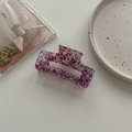 Detailed close-up of a purple marble acetate hair claw clip on an aesthetic ceramic tray - Large Square Claw / Floral Purple