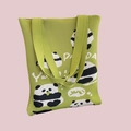 Detail of green knitted tote bag featuring panda patterns and YUM text design - Five Bears Green