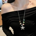 Star pendant necklace with colorful beads on a silver chain worn by a fashion model - Silver Colored Beads Star Style