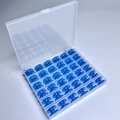 36 Blue Bobbins In A 36-compartment Box / Shuttle Core Storage Box