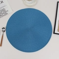 Blue round woven dining placemat with heat resistant texture on a minimalist table set - Blue