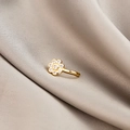 Macro detail of golden flower nose ring with micro-pave zircons on gray silk - Seven-Star Flower (E5689-9)