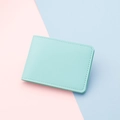Slim mint green faux leather card holder with litchi texture and minimalist bifold design - Blue