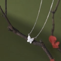 S925 sterling silver butterfly necklace with white mother-of-pearl pendant on a branch - 925 Silver / White Gold