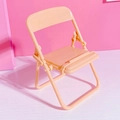 Mini foldable chair phone stand in pastel orange finish for desktop decoration - Orange
