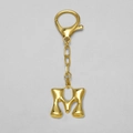 3D bubble letter M keychain in 18k gold plating with lobster clasp attachment - Letter M