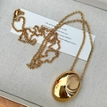 Chic gold teardrop long necklace with oversized polished oval pendant on metal chain - Gold
