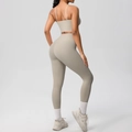 Rear view of greige yoga set showing back details of crop top and high waist leggings - Camel Brown