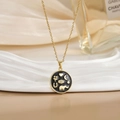 Gold-plated necklace with moon and elephant round pendant on elegant white display - Round Black Heart Elephant Moon Style (XL0465A)