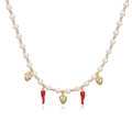 Detailed view of pearl necklace featuring gold strawberry and red chili fruit pendants - Gold Red Chili & Smooth Strawberry Necklace