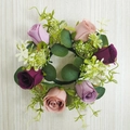 Artificial purple and pink rose candle ring wreath with eucalyptus leaves on wood - Deep purple