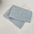 Close-up of blue and white checkered cotton placemat with textured fabric details - 37x28 / Light Blue