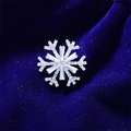 Elegant silver snowflake brooch with shimmering rhinestones and cat eye stone finish - Silver Snowflake Style (90246J)