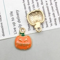 Front and back views of two orange Halloween pumpkin lantern metal pendant charms - Stitched Pumpkin (12*16mm)