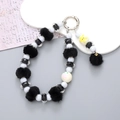 Phone wrist strap with black plush pom-pom, spotted beads, and cute cartoon charms - Black Pompom Pendant Style (K2671)