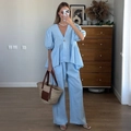 Women's blue linen two-piece set featuring V-neck puff sleeve top and wide-leg pants - S / Blue