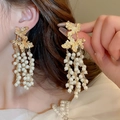 Elegant gold maple leaf earrings with white pearl tassels and realistic leaf textures - Gold Leaf Pearl Style
