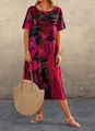Close-up of bohemian summer dress featuring vibrant abstract floral prints and crew neck - S / Dresses / Red