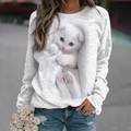 Détail de l'imprimé chat aux yeux bleus 3D sur ce sweat-shirt blanc à manches longues - S / Hauts / Manches longues / Blanc