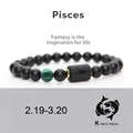 Detail of Pisces constellation bracelet with matte black onyx and green malachite beads - Pisces