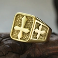 Macro detail of gold cross signet ring with hammer texture on a vintage wood base - US 6 / Gold