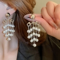 Elegant silver open hoop earrings with dangling white pearl tassels on a fashion model - 3# Silver Earring Post - Silver - White - Pearl Tassel