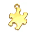 Detailed view of a gold puzzle piece pendant charm with a polished metallic finish - Gold