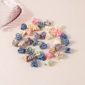 Mini macaron colorful hair claws for princess hairstyles on a soft pink background - Octopus Style / Bulk Packaging / Macaron Series