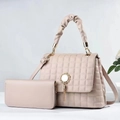 Close-up of beige quilted bucket bag with metal tassel detail and matching wallet - Large Bag and Wallet Set / Khaki