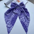 Retro purple paisley print hair clip with a large fabric ribbon bow and spring fastener - Purple Cashew Print Ribbon
