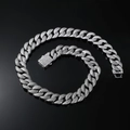 Detail of 16mm silver Cuban link chain with encrusted rhinestones on black reflective surface - 20 Inch (50cm) / Silver