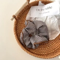 Brown houndstooth ribbon scrunchie hair tie in a woven basket for hair styling accessories - Houndstooth Coffee