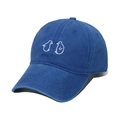 Detail view of washed blue cotton baseball cap featuring a white penguin embroidery - 56cm-60cm / Blue