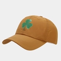 Macro detail of breathable clover print fabric and curved brim on yellow baseball cap - Camel / Adjustable